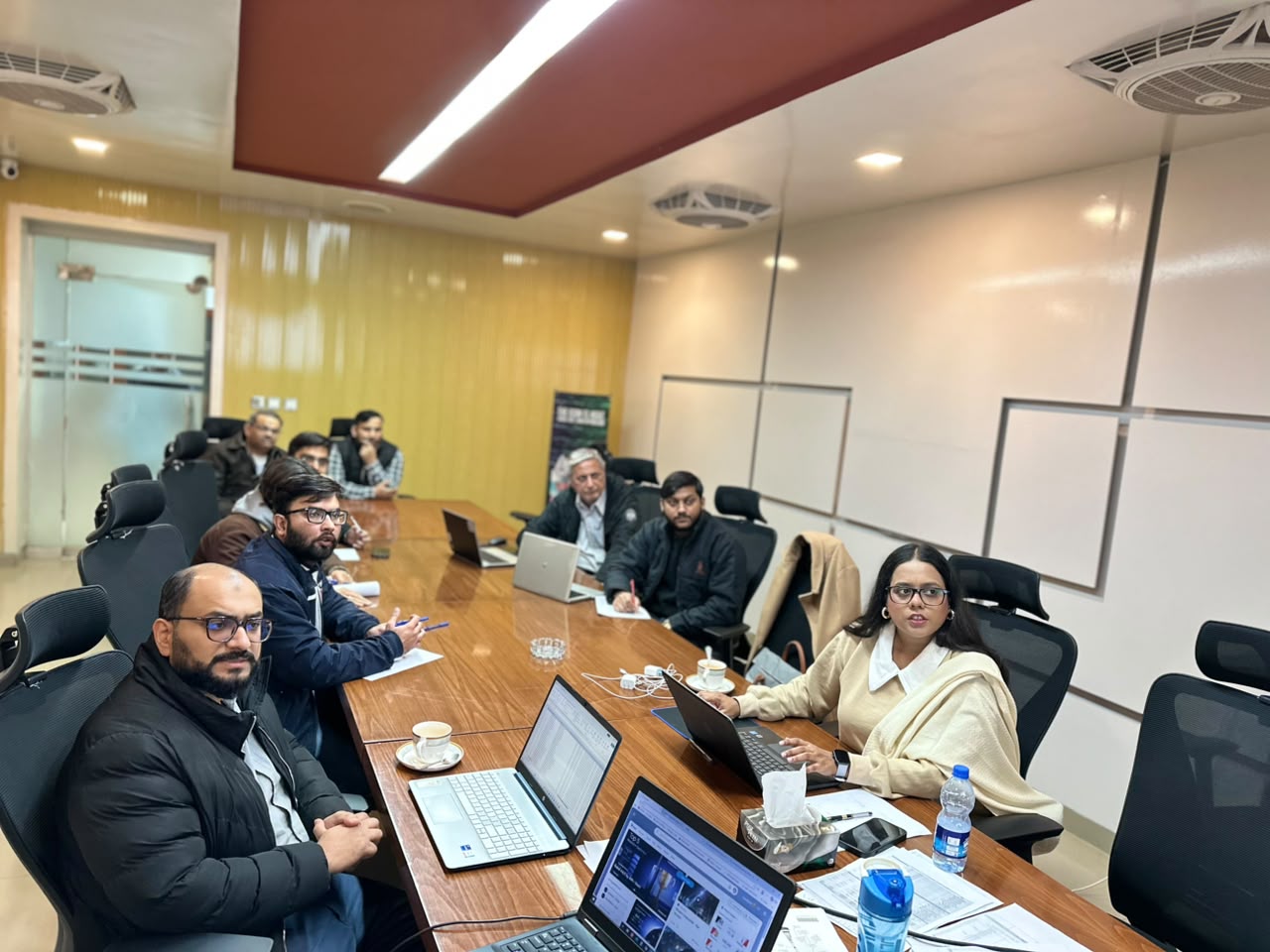 Hisaab.pk team in a working session around the table